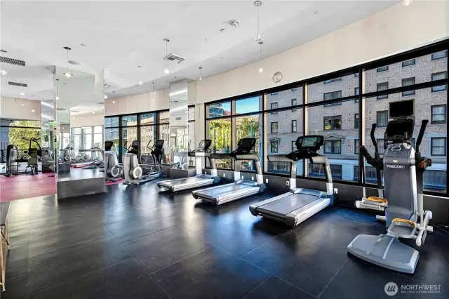 Expansive fitness center with state-of-the-art equipment and views of lively Virginia Avenue