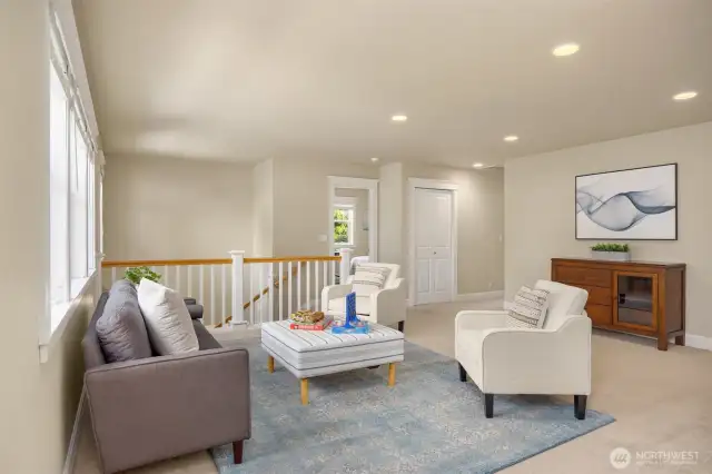 Spacious upstairs landing is the perfect space to spread out and enjoy time with loved ones.