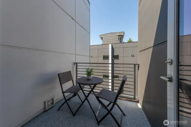 Cozy balcony off the primary bedroom.