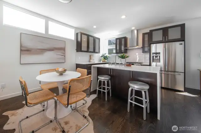 On the main level, the  bright and functional kitchen has plenty of counter space and stylish finishes.