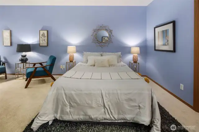Spacious primary bedroom featuring ample room for a home office and cozy lounge seating. Enjoy the comfort of a generous walk-in closet and an en-suite full bathroom—your perfect retreat for rest, work, and relaxation.  Spacious primary bedroom featuring ample room for a home office and cozy lounge seating. Enjoy the comfort of a generous walk-in closet and an en-suite full bathroom—your perfect retreat for rest, work, and relaxation.