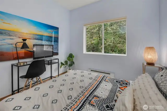 Spacious second bedroom comfortably fits a queen-size bed with room to spare for a home office desk—ideal for guests, remote work, or a peaceful retreat.