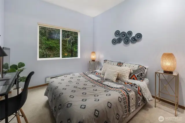 Spacious second bedroom comfortably fits a queen-size bed with room to spare for a home office desk—ideal for guests, remote work, or a peaceful retreat.