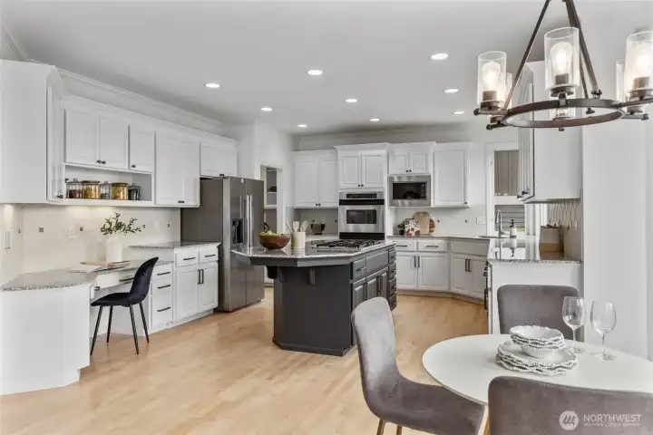 Ample seating with breakfast nook & large kitchen island.