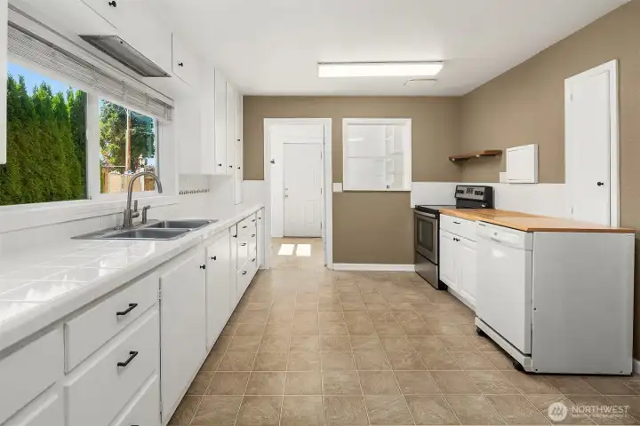 Large kitchen with ample counter space and storage.