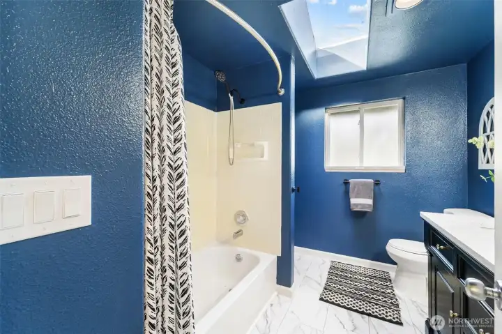 Jack n Jill bathroom with skylights bring in even more natural light
