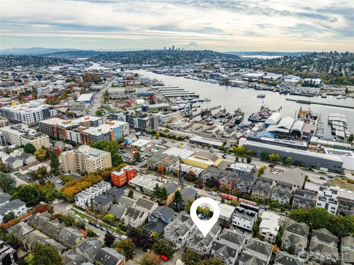 Mt Rainier frames the city skyline. Downtown Ballard's restaurants and shops just steps away. The Ballard Bridge; one of the old bascule bridges. Ballard's working waterfront.