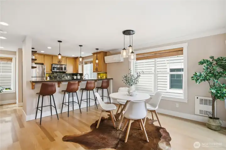 The open layout yields separate spaces for cooking, eating and conversation; yet all joined together.