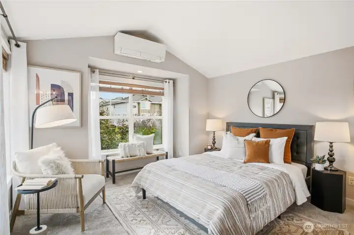 Primary: vaulted ceilings and a large window bring in generous light and open up the space. A/C, of course.