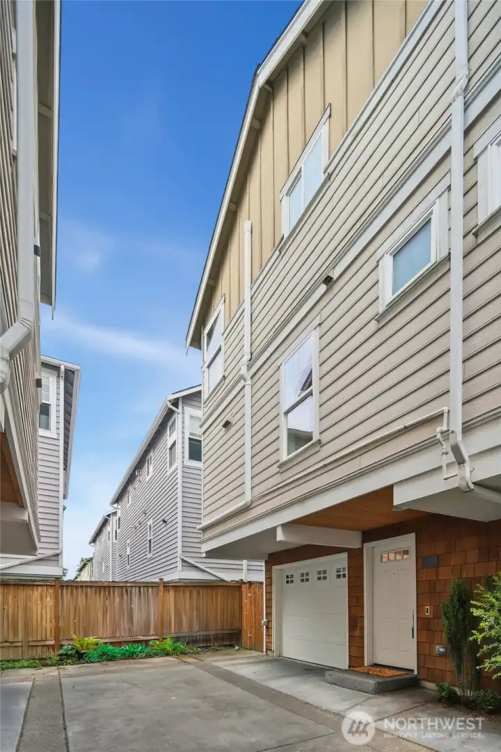 End unit with attached garage.