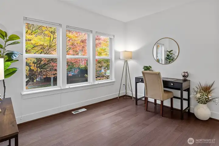 The spacious living room offers flexible design potential; additional office or cozy sitting area to enjoy PNW weather