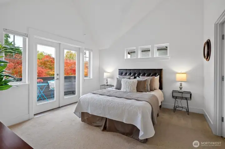 Spacious primary suite with vaulted ceilings and abundant natural light.