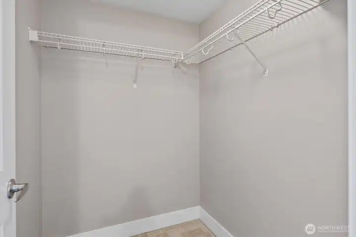 Spacious walk-in closet offering ample storage and organization options.