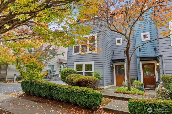 Two-car attached garage with alley access and low-maintenance exterior.