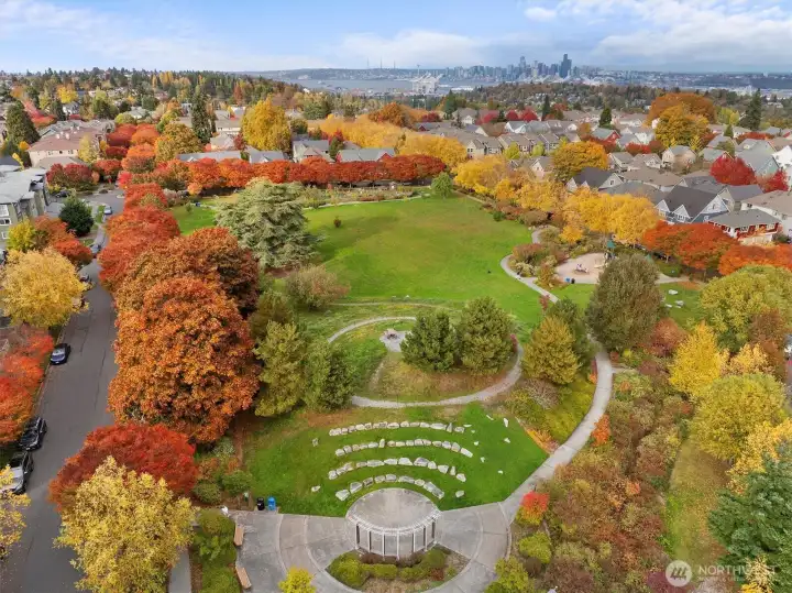 Steps from High Point Commons Park with views toward downtown Seattle.