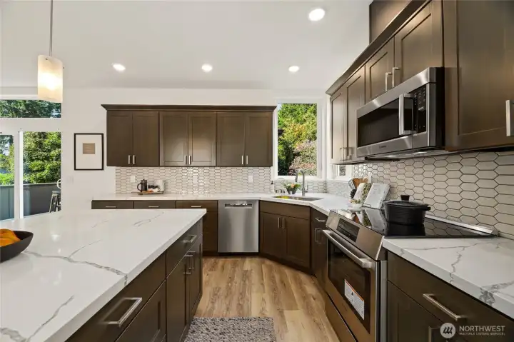 Modern kitchen with large island and Bosch Appliances.