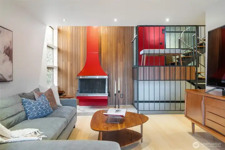 Iconic fireplace anchors the spacious living room.