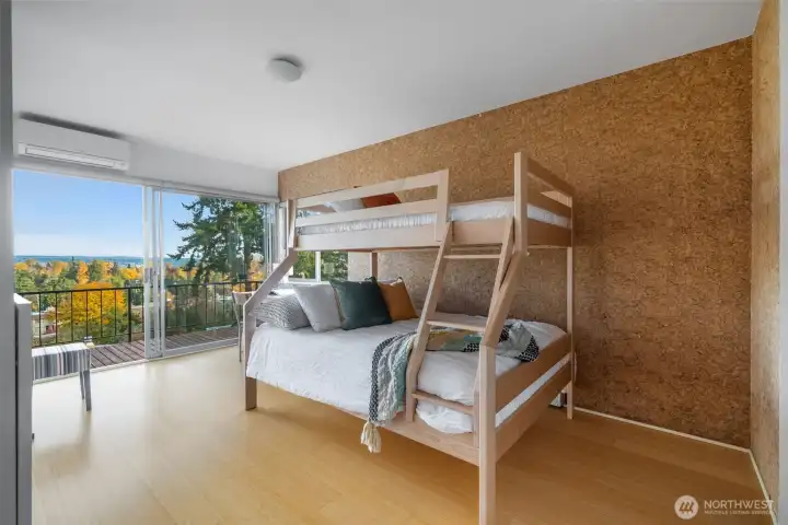 Generously sized bedroom with ample light.