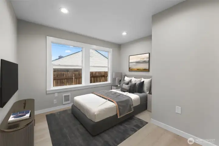 Virtually staged photo of 2nd guest bedroom.