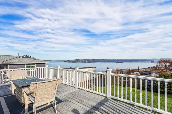 A door leads straight out to this professionally built and fully-enclosed deck with open views of the Salish Sea.