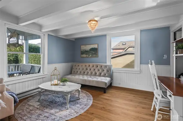 Both front rooms offer flexible space. Set up an office, lounge area, or library overlooking the covered porch and garden.