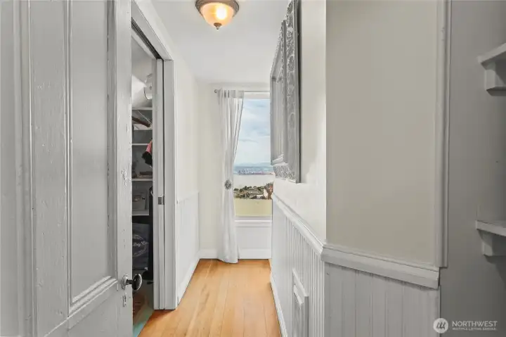 A door opens from the landing into this hall leading to a closet, another water view, and the 3/4 bath.