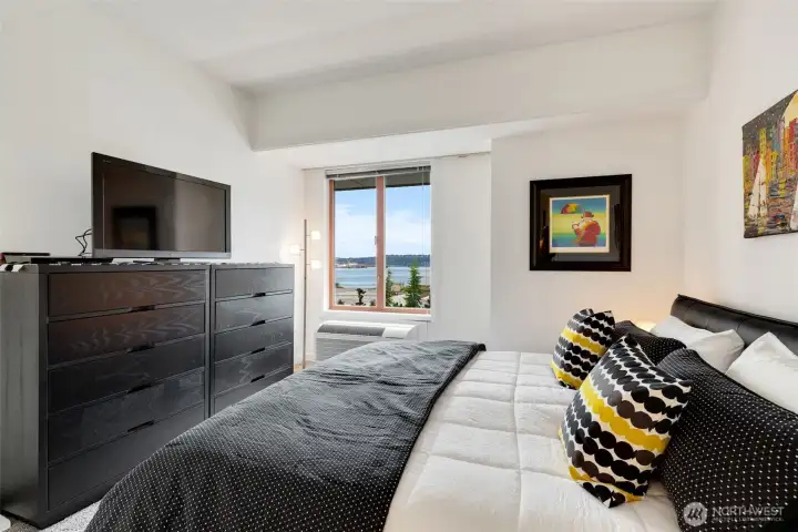West-facing bedroom with air conditioning and picture window overlooking Puget Sound.