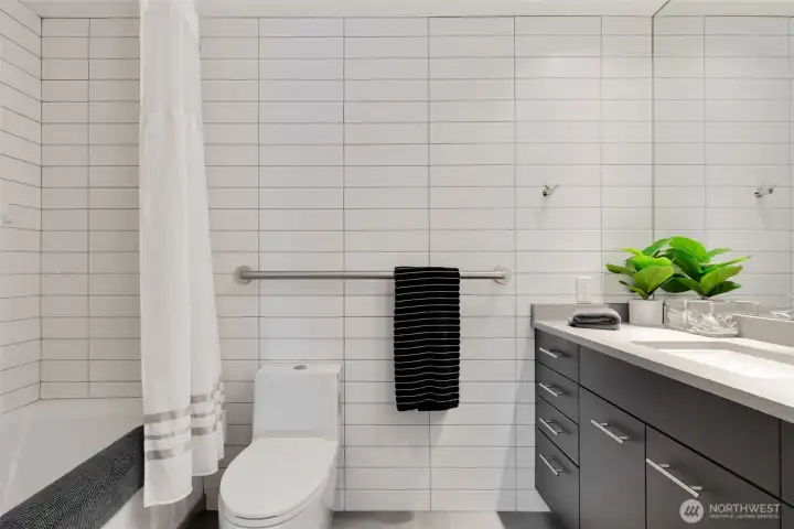 Bathrooms updated in 2018 with new cabinets, floors, countertops, full-tiled walls, toilets, faucets, etc.