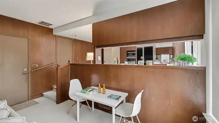 Enjoy this flexible space just steps from the kitchen, ideal for a small dining area, game table, or work-from-home setup.