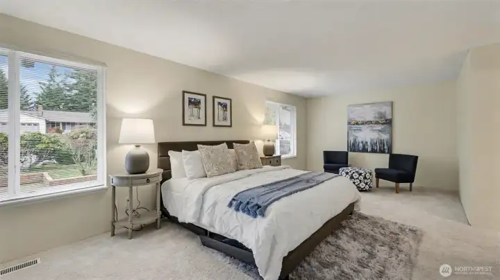 This expansive primary room provides flexibility for a seating area, reading corner, or quiet retreat.