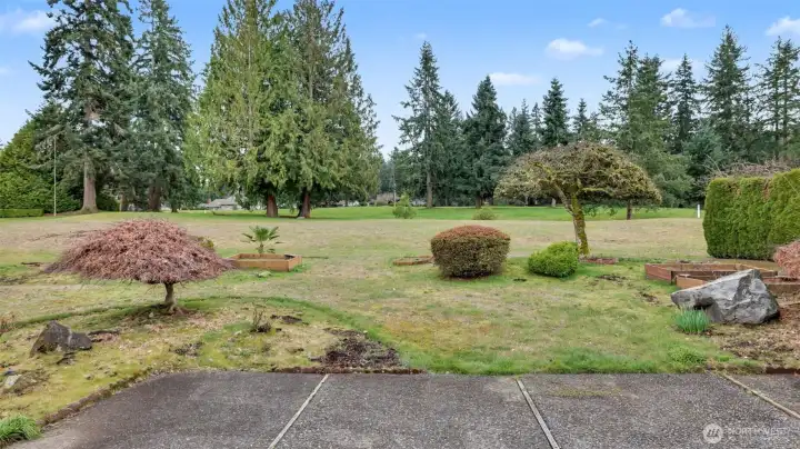 Enjoy morning coffee or evening gatherings with serene golf course views of the 8th hole.