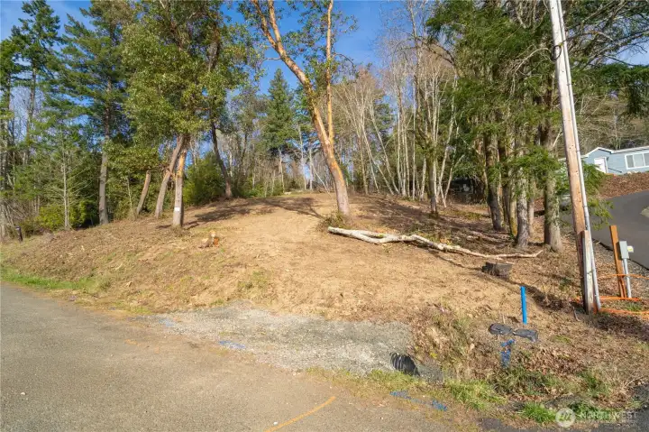 Looking from E Midway towards the parcel up hill from street