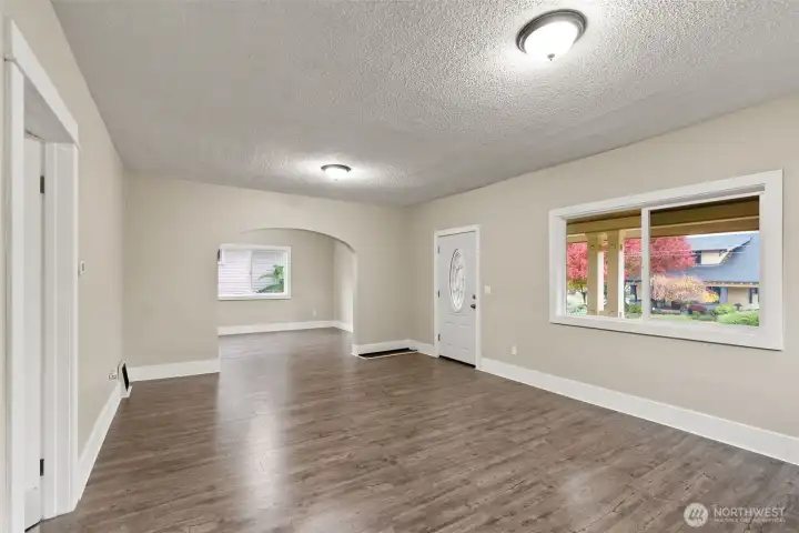 Main level, living area with arched side entry. Main level, living area with arched side entry.