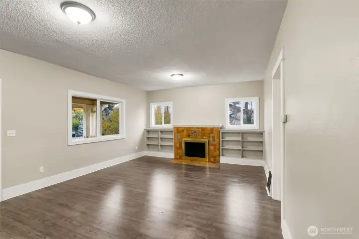 Cozy fireplace with built-in shelving.