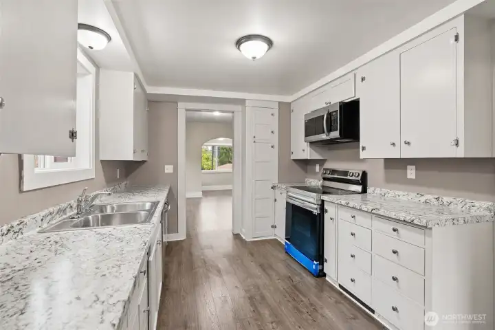 Bright kitchen with convenient flow to living areas. Bright kitchen with convenient flow to living areas.