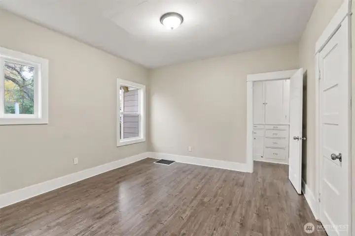 Bedroom with extra storage in hallway.