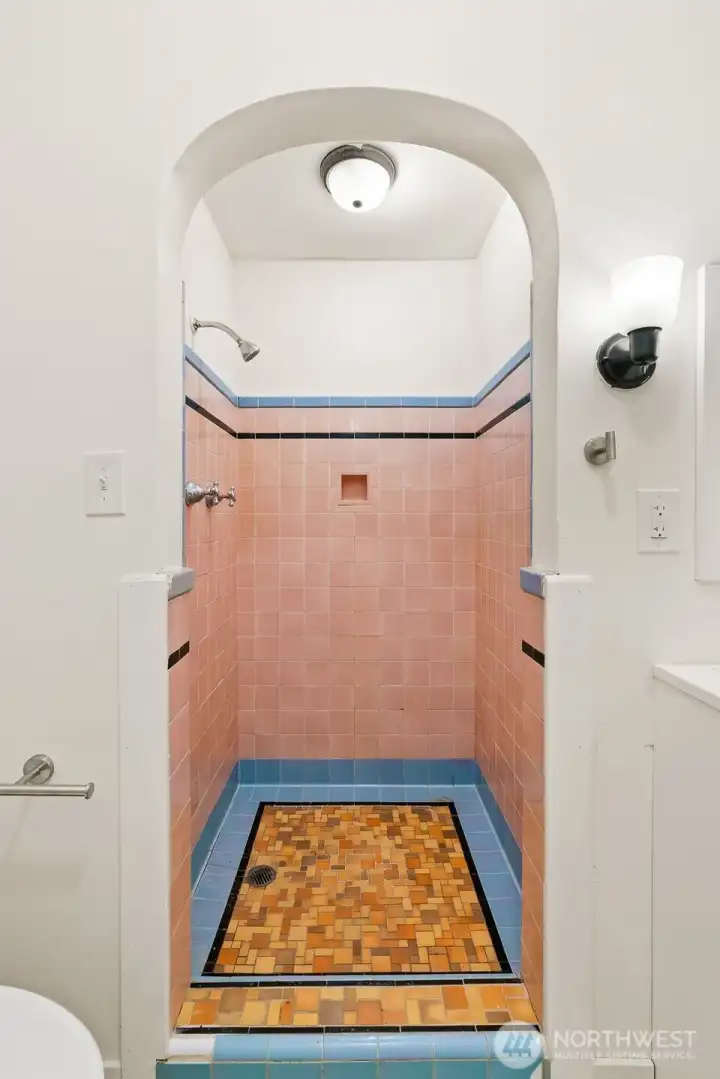 Walk-in shower with unique tile character. Walk-in shower with unique tile character.