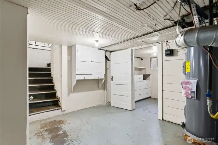 Lower level with stair access and storage space.