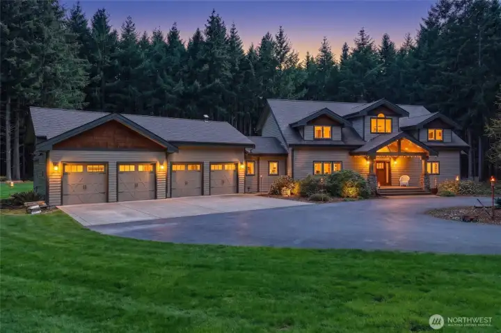 Nearly 10 acres of beautiful lawn, gardens, and wooded privacy set the scene for this INCREDIBLE Lindal Cedar home!