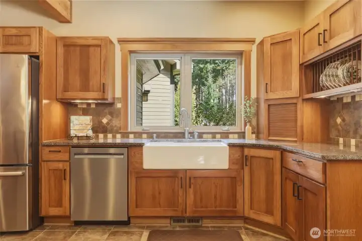 Tile details, wood wrapped windows, and a green view out every window...