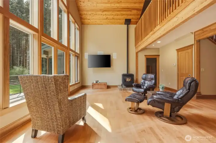 Main floor primary provides easy living; catwalk above connects the two levels and allows for a view from everywhere!