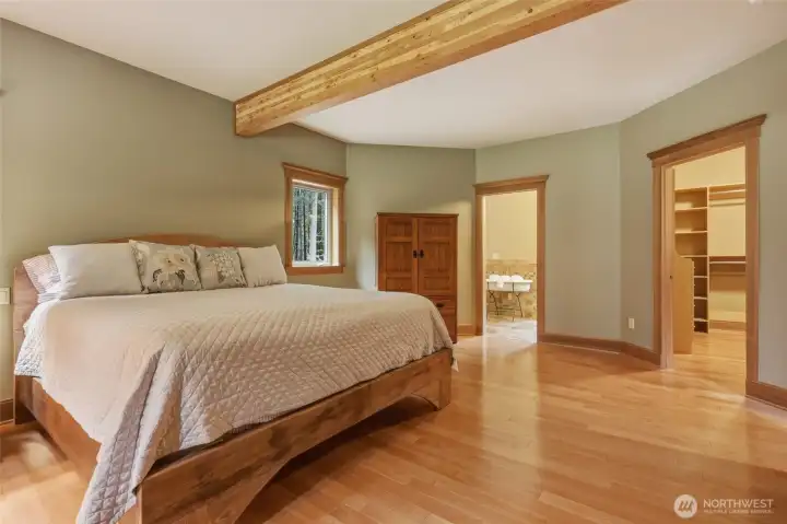 The trim package in this home is absolutely incredible!  See crown molding over every window and door.  Walk-in-closet seen ahead with complete built-ins and great lighting.