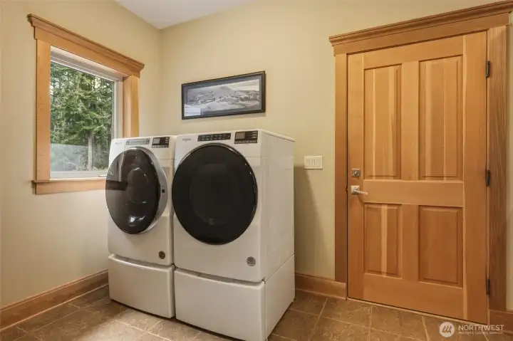 Laundry hookup is in this same mudroom; garage door seen here. Outdoor views from every room!