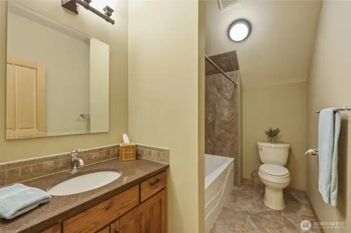 Hall bath upstairs next to bedrooms 3 and 4.