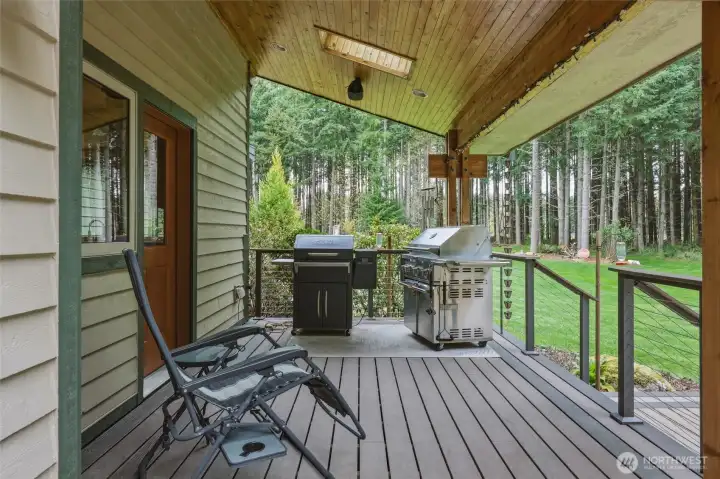 Covered area off the kitchen is ideal for BBQing, with skylights and recessed lighting for maximum visibility.