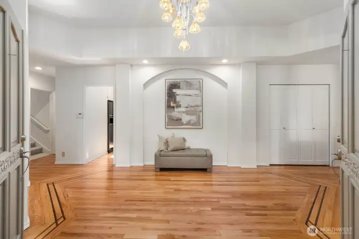 Welcoming entry with original hardwood floors.