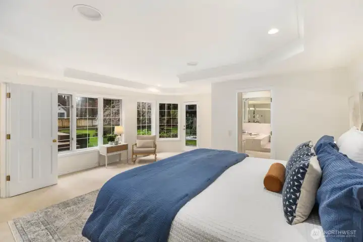 Primary suite with peaceful views of the backyard.