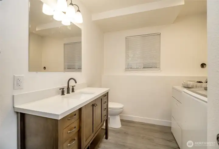 Fully updated bathroom with second laundry area