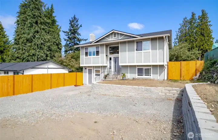 Welcome Home! New roof, lots of parking and very low maintenance yard