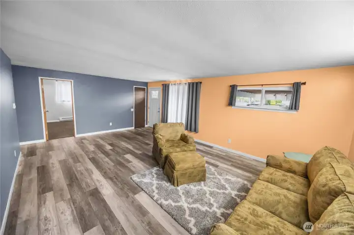 From right to left- front door, coat closet, bedroom number one on main floor.